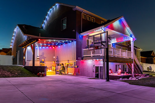 Trimlight red, white, and blue lights on a house.